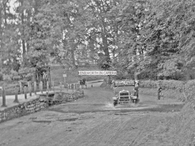 Charabanc passes through ford